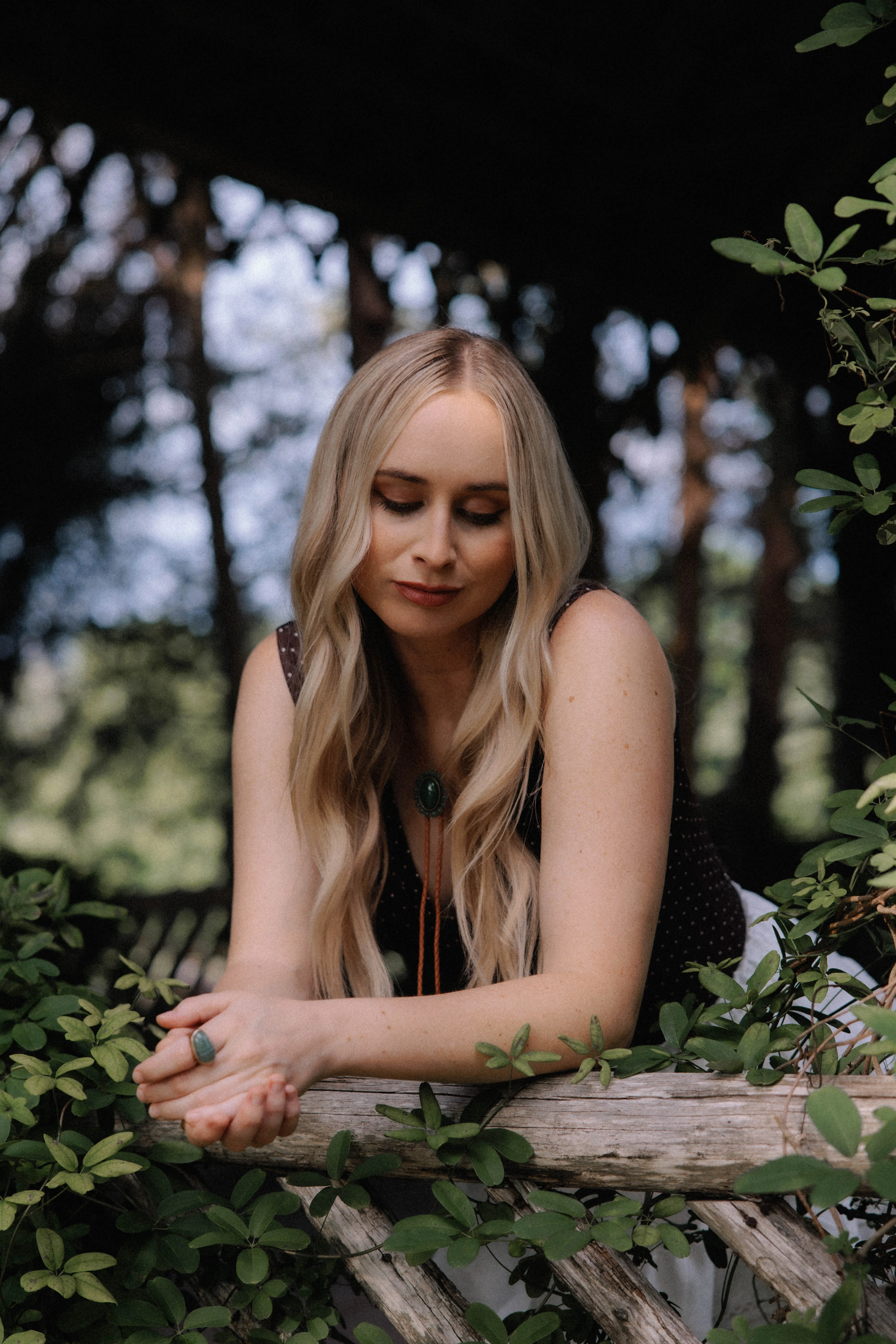 Melanie Dyer in a green woodland setting